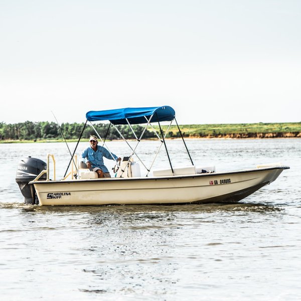 Captain on the boat cruising around in the bay