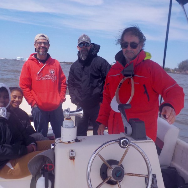 Captain John and company on a brisk boat ride