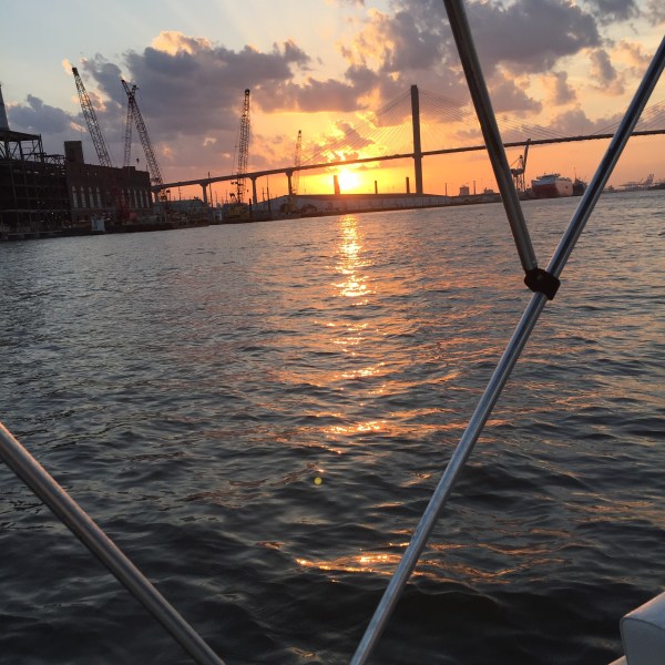 shot of the sunset through the boat awning