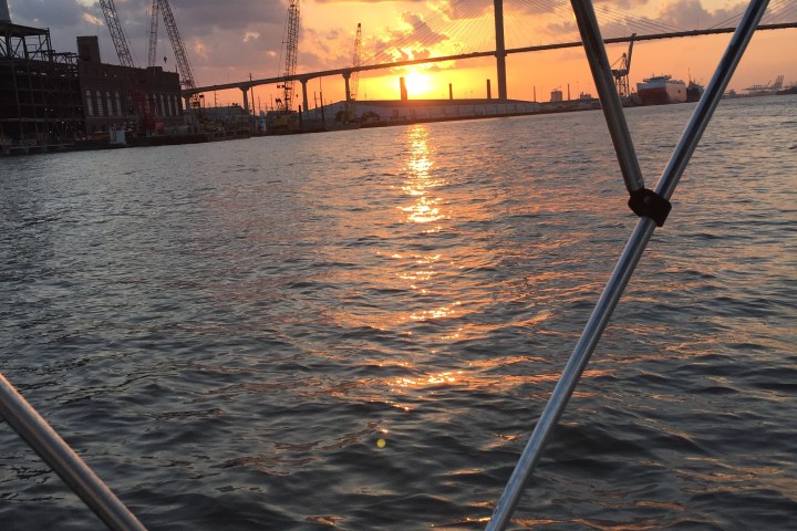 shot of the sunset through the boat awning