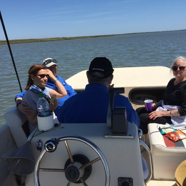 passengers sitting at the front of the boat