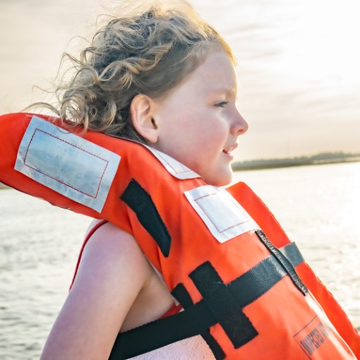 a little girl in a body of water