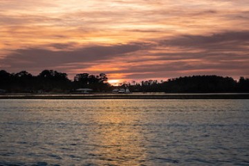 a sunset over a body of water