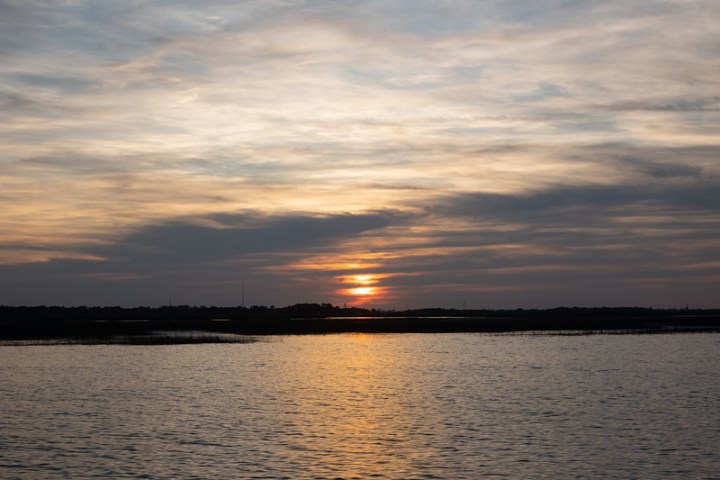 a sunset over a body of water