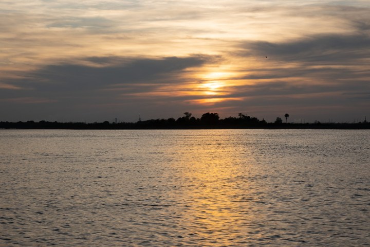 a sunset over a body of water