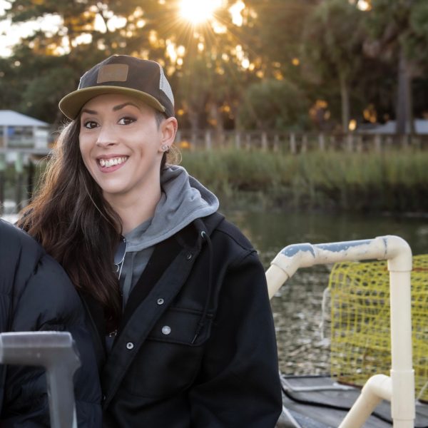 a woman sitting at a picnic table