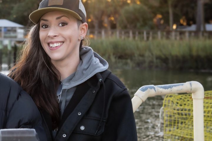 a woman sitting at a picnic table